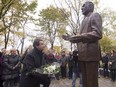 Quebec Opposition Leader Pierre Karl Peladeau lays flowers at the foot of the statue of former premier René Lévesque, at a ceremony marking the 28th anniversary of his death, Thursday, October 29, 2015 at the legislature in Quebec City.