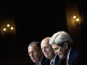 From left, Russian Foreign Minister Sergei Lavrov, UN Special Envoy for Syria Staffan de Mistura and Secretary of State John Kerry participate in a news conference in Vienna, Austria, on Friday, Oct. 30, 2015. The U.S., Russia and more than a dozen other nations have directed the U. to begin a new diplomatic process with Syria's government and opposition with the goal of reaching a nationwide cease-fire and political transition.