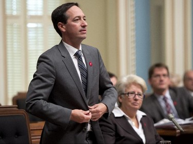 Quebec Opposition Leader Stephane Bedard stands to vote against a motion on ethics that points to opposition MNA Pierre-Karl PÈladeau and his ownership of media, Thursday, October 9, 2014 at the legislature in Quebec City.