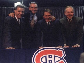 New Canadiens GM Réjean Houle, coach Mario Tremblay, president Ronald Corey and assistant coach Yvan Cournoyer pose for photo at the Forum on Oct. 21, 1995.