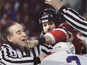 Devils' Mike Peluso bounces a punch off Habs' Lyle Odelein and nails linesmen Gérard Gautier on the chin.