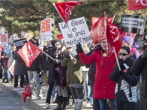 Teachers and workers from Vanier College take part in a province-wide rotating strike Monday, October 26, 2015 in Montreal to protest against government austerity measures.