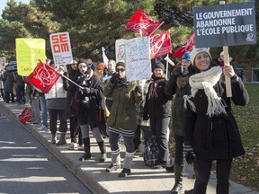 Teachers and workers from Vanier College take part in a province wide rotating strike Monday, October 26, 2015 in Montreal to protest against government austerity measures.