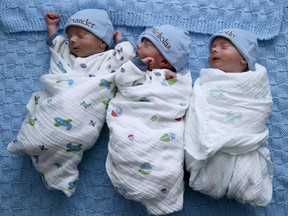 Identical triplets Alexander, Nicholas and Timothy Whiteley snooze at home in Michigan in 2015.