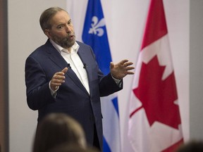 NDP Leader Tom Mulcair addresses supporters during a campaign stop in Montreal on Thursday, Oct. 1, 2015.