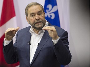 NDP Leader Tom Mulcair addresses supporters during a campaign stop in Montreal on Thursday, Oct. 1, 2015.