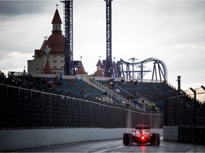 Ferrari's Sebastian Vettel drives in the pits during the second practice session of the Russian Formula One Grand Prix at the Sochi Autodrom circuit on October 9, 2015.