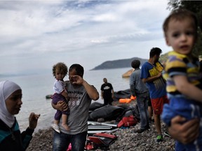 Migrants and refugees arrive to the Greek island of Lesbos after crossing the Aegean sea from Turkey on September 26, 2015. UN Secretary-General Ban Ki-moon welcomed the European Union's decision to inject $1 billion to help countries overwhelmed by Syrian refugees, but said more must be done to relocate migrants.