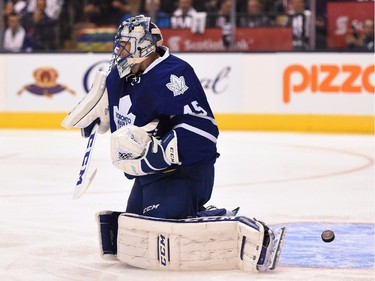 Toronto Maple Leafs goalie Jonathan Bernier can't stop a shot from Montreal Canadiens' Max Pacioretty as he scores during first period season opener NHL action in Toronto on Wednesday, Oct. 7, 2015.