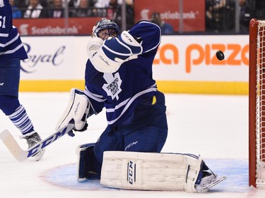 Toronto Maple Leafs goalie Jonathan Bernier can't stop a shot from Montreal Canadiens' Alex Galchenyuk, not shown, as he scores during third period NHL action in Toronto on Wednesday, Oct. 7, 2015.