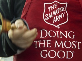 Salvation Army volunteer Bubba Wellens rings the collection bell outside a Giant grocery store November 24, 2012, in Clifton, Virgina.  Salvation Army volunteers traditionally are seen collecting donations from holiday shopper for the needy between Thanksgiving and Christmas.             AFP Photo/Paul J. Richards PAUL J. RICHARDS/AFP/Getty Images ORG XMIT: US-CHARIT