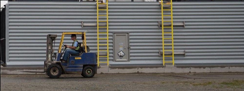 A worker drives a forklift at Calgary-based Carbon Engineering's first direct air capture plant in Squamish, B.C., on Wednesday October 7, 2015. The plant extracts carbon dioxide directly from atmospheric air in a closed-loop industrial process. A pellet reactor system is used to take the carbon dioxide that has been absorbed from the air into liquid in an air contractor and transform it into a solid pellet which can be dried and moved to a calciner for carbon dioxide release and purification.