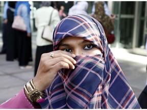 Zunera Ishaq talks to reporters outside the Federal Court of Appeal after her case was heard on whether she can wear a niqab while taking her citizenship oath, in Ottawa on Tuesday, September 15, 2015.