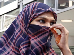 Zunera Ishaq talks to reporters outside the Federal Court of Appeal after her case was heard on whether she can wear a niqab while taking her citizenship oath, in Ottawa on Tuesday, September 15, 2015.