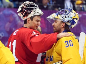 Team Canada's Carey Price (left)  is congratulated by Henrik Lundqvist of Sweden after Canada's hockey gold medal win at the Sochi 2014 Olympic Winter Games on Feb. 23, 2014.