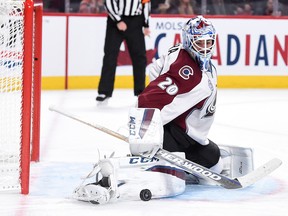 Colorado Avalanche goaltender Reto Berra makes a pad save, one of 39 shots he stopped, in his team's 6-1 win over the Canadiens at the Bell Centre on Nov. 14, 2015.