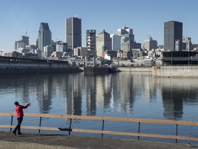 A man fishes off the shores of the St. Lawrence River, Tuesday, November 10, 2015 in Montreal. The city of Montreal will begin a massive sewage dump Wednesday for repairs to its sewage infrastructure, dumping 8 billion litres of untreated wastewater into the St. Lawrence over the space of a week.