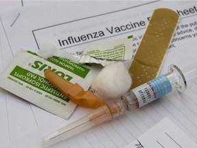 A syringe with the flu vaccine sits ready for use.