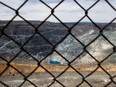 A small lake is seen at the bottom of the 2.5 kilometre-wide asbestos mining pit at Mine Jeffrey Inc. located in the town of Asbestos, Quebec, 170 kilometres east of Montreal on Thursday, April 22, 2010.