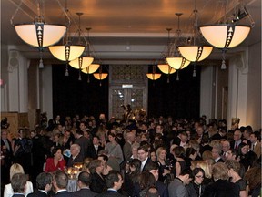 Guests enjoy a festive cocktail-dinatoire at a 2012 fundraising event. Peter Ford.