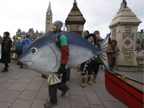 People participate in the The 100% Possible Climate March on Parliament Hill in Ottawa Nov. 29, 2015.