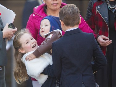 Ella-Grace Trudeau lifts her baby brother Hadrien as they wait for their father Prime Minister designate Justin Trudeau who is to be sworn in as the 23rd Prime Minister of Canada at Rideau Hall in Ottawa, Ontario, November 4, 2015.