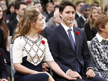 Justin Trudeau and his wife Sophie Grégoire hold hands before he is sworn-in as Canada's 23rd prime minister during a ceremony at Rideau Hall in Ottawa November 4, 2015.