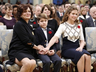 Justin Trudeau's wife Sophie Grégoire (R), son Xavier and mother Margaret (L) hold hands before he is sworn-in as Canada's 23rd prime minister during a ceremony at Rideau Hall in Ottawa November 4, 2015.