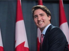 Liberal party leader Justin Trudeau smiles at the end of a news conference in Ottawa on Oct. 20, 2015 after winning the general election.
