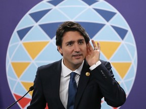 Prime Minister Justin Trudeau listens to a question during a news conference following the Asia-Pacific Economic Cooperation Summit of Leaders Thursday, Nov. 19, 2015 in Manila, Philippines. It's a pretty safe bet there will be plenty of questions for the PM once he returns home from his first foreign trip since winning the Oct. 19 election. (AP Photo/Bullit Marquez)