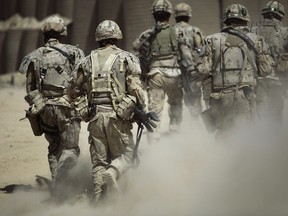 Canadian soldiers shown on patrol outside Salavat, in the Panjwayi district, southwest of Kandahar, Afghanistan, Monday, June 7, 2010. Almost 14 per cent of Canadian Forces members who served in the Afghanistan mission were diagnosed with a mental health disorder linked directly to their tour, according to a military study that some say doesn't reflect the larger extent of the problem.The report, funded by the Forces and written by military staff, found that eight per cent of personnel who deployed between 2001 and 2008 were found to have post-traumatic stress disorder, or PTSD.