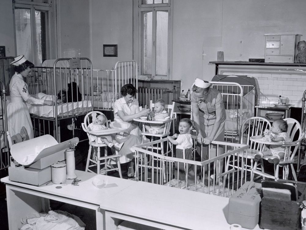 Nurses are seen caring for young children at the Montreal Children's Hospital in February 1955.