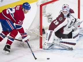 Monttreal Canadiens' Dale Weise (22) moves in on Colorado Avalanche's goaltender Reto Berra during first period NHL hockey action in Montreal on Saturday, Nov. 14, 2015.