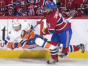 Canadiens' Devante Smith-Pelly, colliding with Islanders' Mikhail Grabovski on Nov. 5, 2015, returns from one game off with a lower-body injury and joins Tomas Plekanec and Max Pacioretty on the Habs' top line.