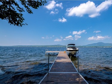 A dock extends into the lake. (Photo courtesy of Royal LePage.)