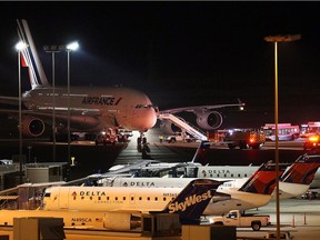 Emergency vehicles are parked near an Air France plane that was diverted to Salt Lake City International Airport, Tuesday, Nov. 17, 2015, in Salt Lake City.