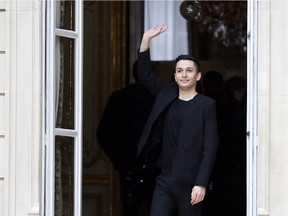 Canada's fashion designer Rad Hourani acknowledges the public at the end of his  2014/2015 Haute Couture Fall-Winter collection fashion show on July 9, 2014 in Paris.