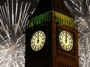Fireworks explode over the clock known as 'Big Ben' housed in Elizabeth Tower, to celebrate the New Year in London, Thursday, Jan. 1, 2015.
