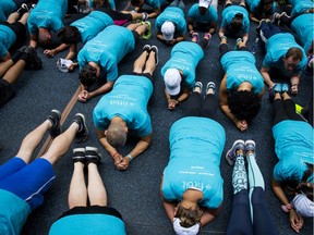 Something has got to give if you want to add a workout to your schedule. Here, people take part in a Fitbit lunchtime workout in New York in June.