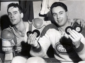 Canadiens' Jean Béliveau holds up four pucks to mark his four-goal night in his team's 4-2 win over the Boston Bruins at the Montreal Forum on Nov. 5, 1955. At left is linemate and fellow future Hall of Famer Bert Olmstead. MANDATORY CREDIT: DAVID BIER, GAZETTE FILES