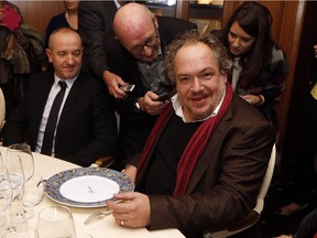 French author Mathias Énard is surrounded by journalists in the Drouant restaurant in Paris after he was awarded the Goncourt Prize for his book "Boussole" (Compass) on November 3, 2015.