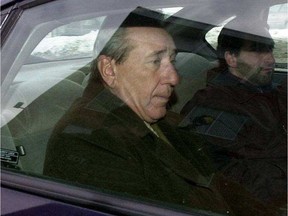 Vito Rizzuto, believed to be Montreal's Mafia boss, is taken from a Montreal police station, after being arrested in his Montreal home on murder charges in te US.  The Gazette/Phil Carpenter.)