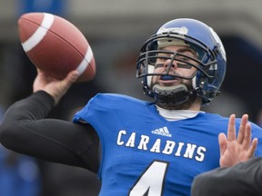 Montréal Carabins quarterback Gabriel Cousineau throws a pass during first half CIS university football semifinal action against the Manitoba Bisons in Montreal, Saturday, November 22, 2014.