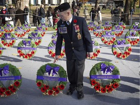 James Riddell of the Royal Canadian Legion's Quebec Provincial Command look at wreaths ahead of Remembrance Day ceremonies held at McGill university in 2014.