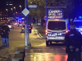 Police secure the area as supporters leave the stadium after the friendly football match Germany vs. the Netherlands was called off for 'security reasons' in Barsinghausen on Nov/ 17, 2015.