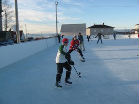 Jack Caddell, foreground, with his father, Andrew, on the ice in Kamouraska in 2006. Andrew Caddell has written The Goal: Stories About Our National Passion. It is filled with stories that all describe actual events, but to Caddell, an Ottawa-based public servant, they are also about tribulation, determination, fellowship and fairness.
