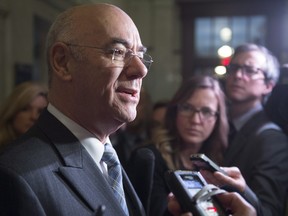 Jacques Daoust, the former economy minister, who was named transport minister Jan. 28, 2016 seen here talking to reporters in November 2015.