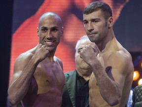 James DeGale, left, and Lucian Bute face each other at the weigh-in in Quebec City on Friday, November 27, 2015 for their Super Middleweight IBF world championship fight. The fight will be held on Saturday at the Vidéotron Centre in Quebec City.