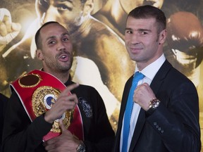 James DeGale, left, and Lucian Bute faced each other at a news conference for Super Middleweight IBF world championship fight 25, 2015 in Quebec City. The fight will be held on Saturday Nov. 28, 2015 at the Videotron Centre in Quebec City.