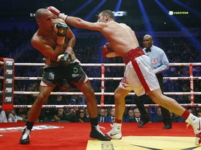 Lucian Bute of Canada throws a punch to James DeGale of England during their IBF super-middleweight championship fight at the Centre Vidéotron on November 29, 2015 in Quebec City, Quebec, Canada.